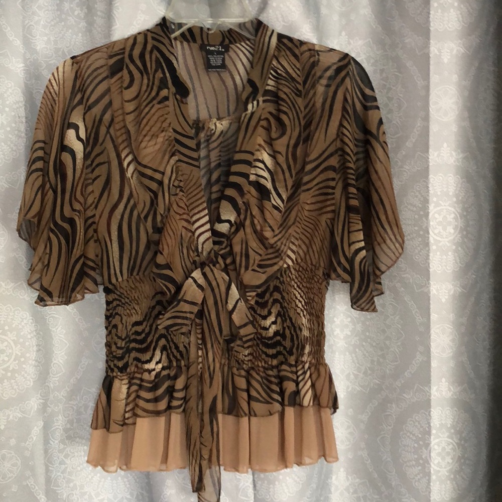 Like new Rue21 animal print ruffled blouse. Size large